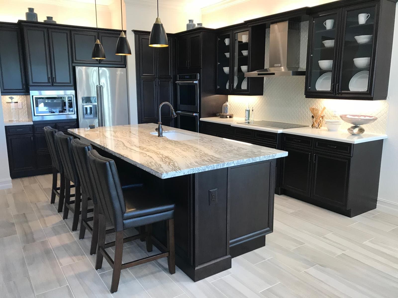 Black cabinetry with granite island - Master Cabinets